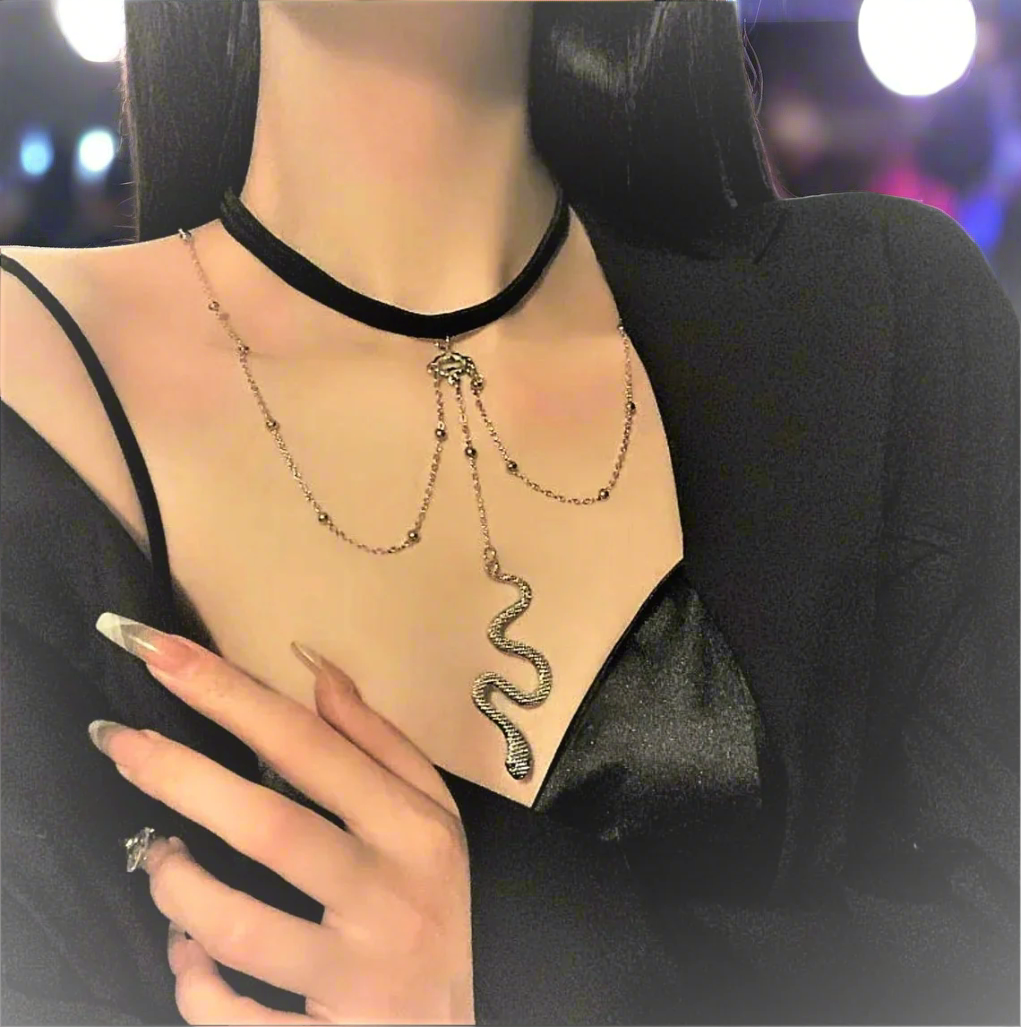 Woman wearing a snake-shaped necklace with a black choker