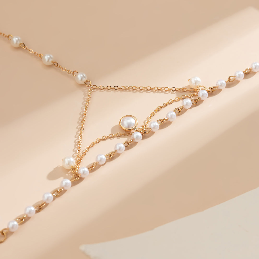 Gold Pearl Hand Chain Bracelet – Elegant Finger Harness Jewelry