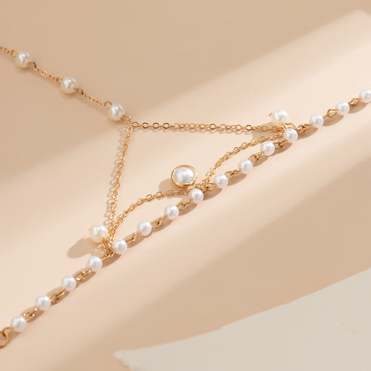 Gold Pearl Hand Chain Bracelet – Elegant Finger Harness Jewelry